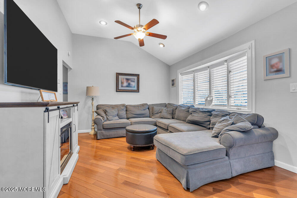 6 Coral Drive Hazlet, NJ 07730 - Photo 11 of 23 a living room with furniture and a flat screen tv