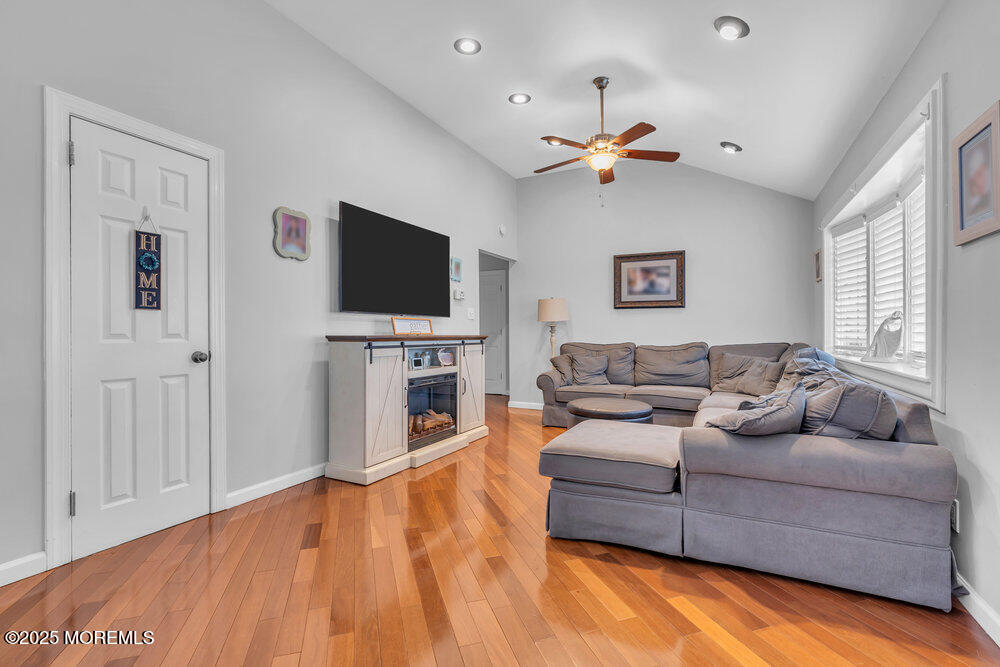 6 Coral Drive Hazlet, NJ 07730 - Photo 12 of 23 a living room with furniture and a flat screen tv