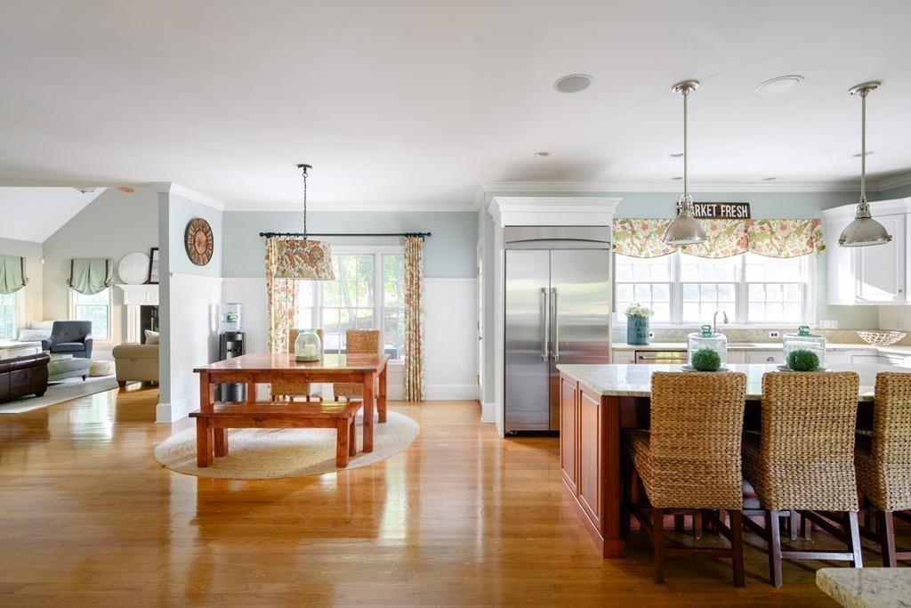 3 Lily Pond Lane Hingham, MA 02043 - Photo 11 of 42 a dining room with furniture a chandelier and wooden floor