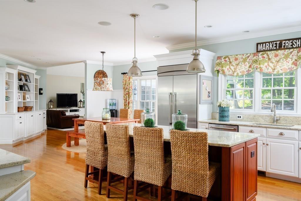 3 Lily Pond Lane Hingham, MA 02043 - Photo 2 of 42 a large kitchen with a table and chairs
