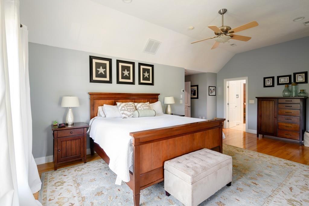 3 Lily Pond Lane Hingham, MA 02043 - Photo 23 of 42 a bedroom with a bed and a ceiling fan