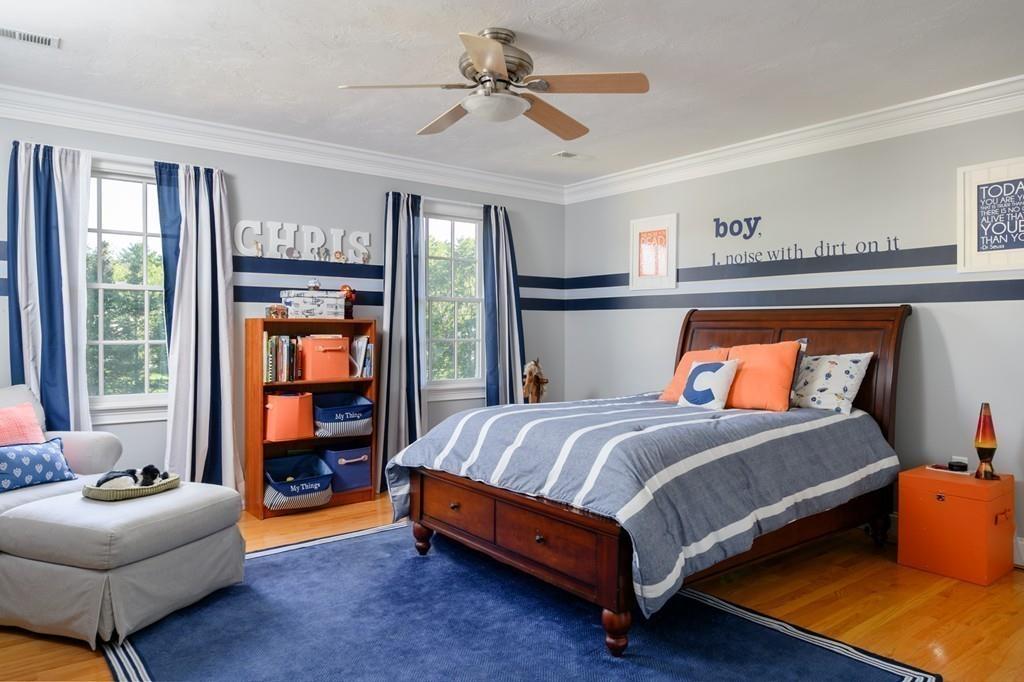 3 Lily Pond Lane Hingham, MA 02043 - Photo 29 of 42 a bedroom with a bed and a couch