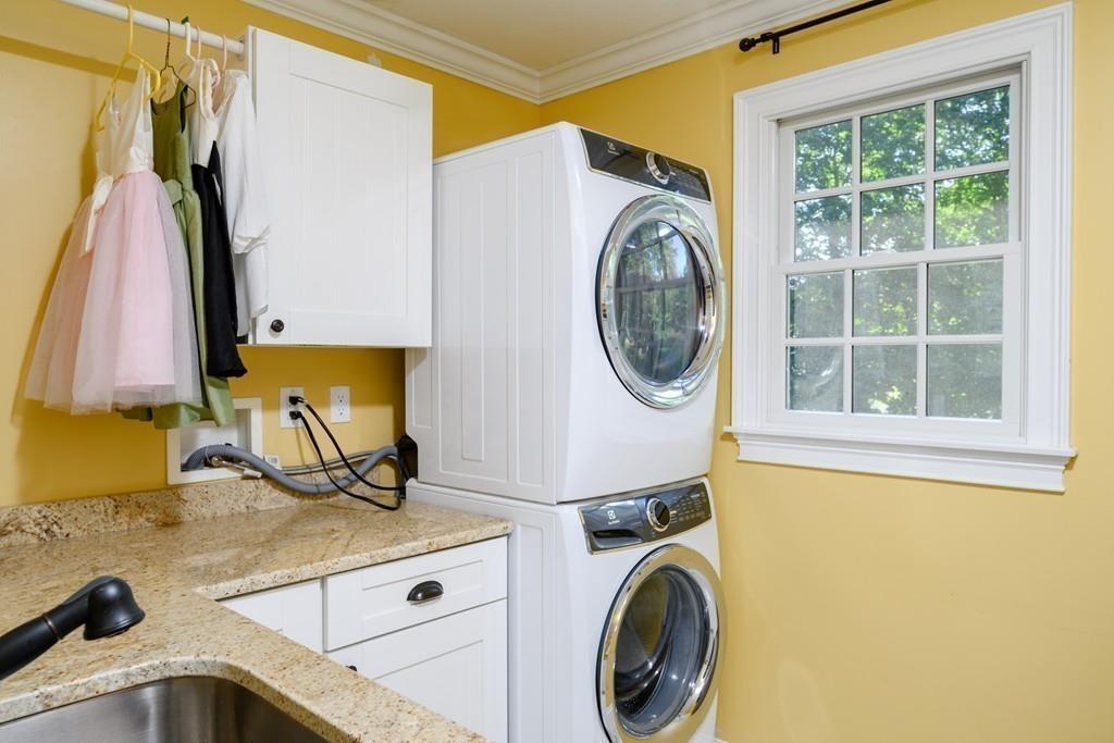3 Lily Pond Lane Hingham, MA 02043 - Photo 30 of 42 a view of a bedroom with a washer and dryer