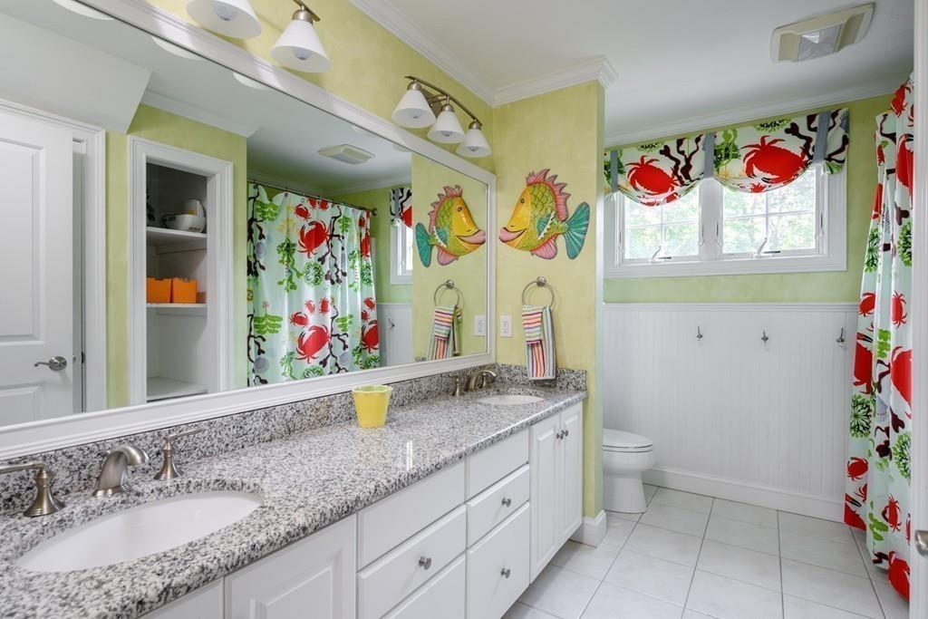 3 Lily Pond Lane Hingham, MA 02043 - Photo 31 of 42 a bathroom with a sink mirror and vanity