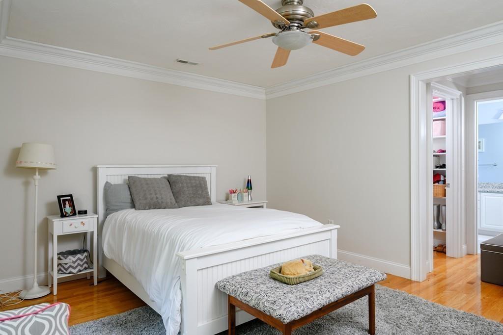 3 Lily Pond Lane Hingham, MA 02043 - Photo 32 of 42 a bedroom with a bed and a table in it