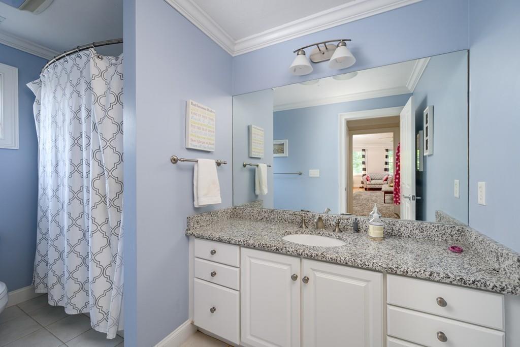 3 Lily Pond Lane Hingham, MA 02043 - Photo 33 of 42 a bathroom with a granite countertop sink and a mirror