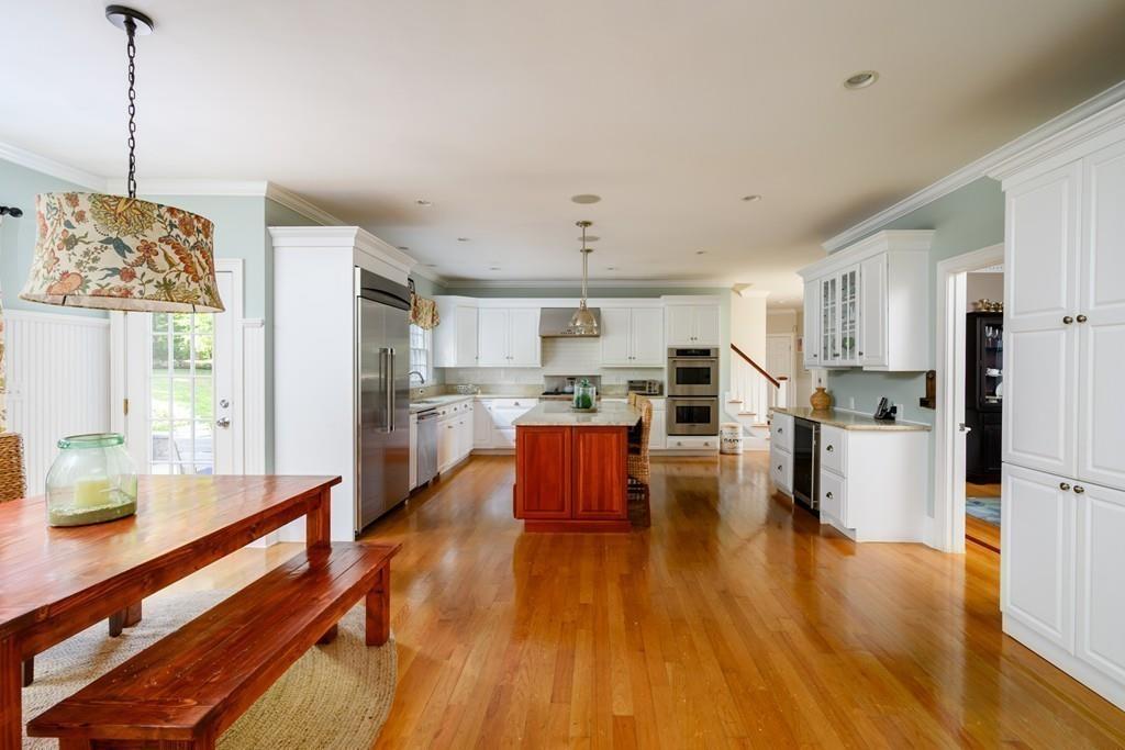 3 Lily Pond Lane Hingham, MA 02043 - Photo 10 of 42 a living room with stainless steel appliances furniture wooden floor and a kitchen view