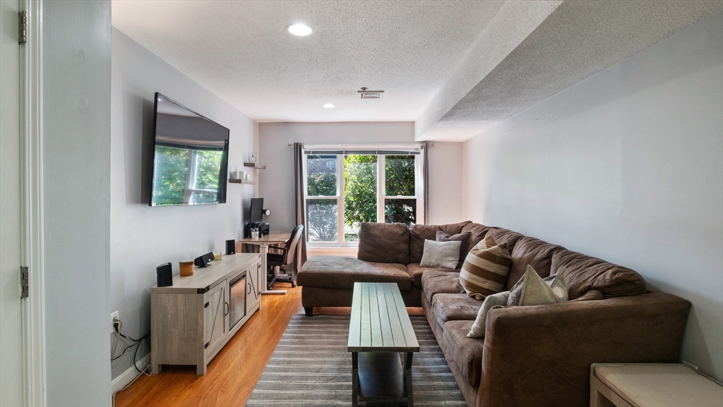 a living room with furniture and a window