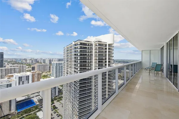 a view of a balcony with city view