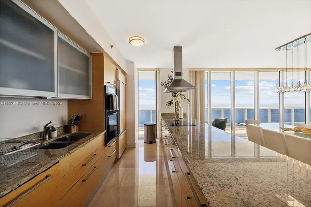 a view of a kitchen with a sink