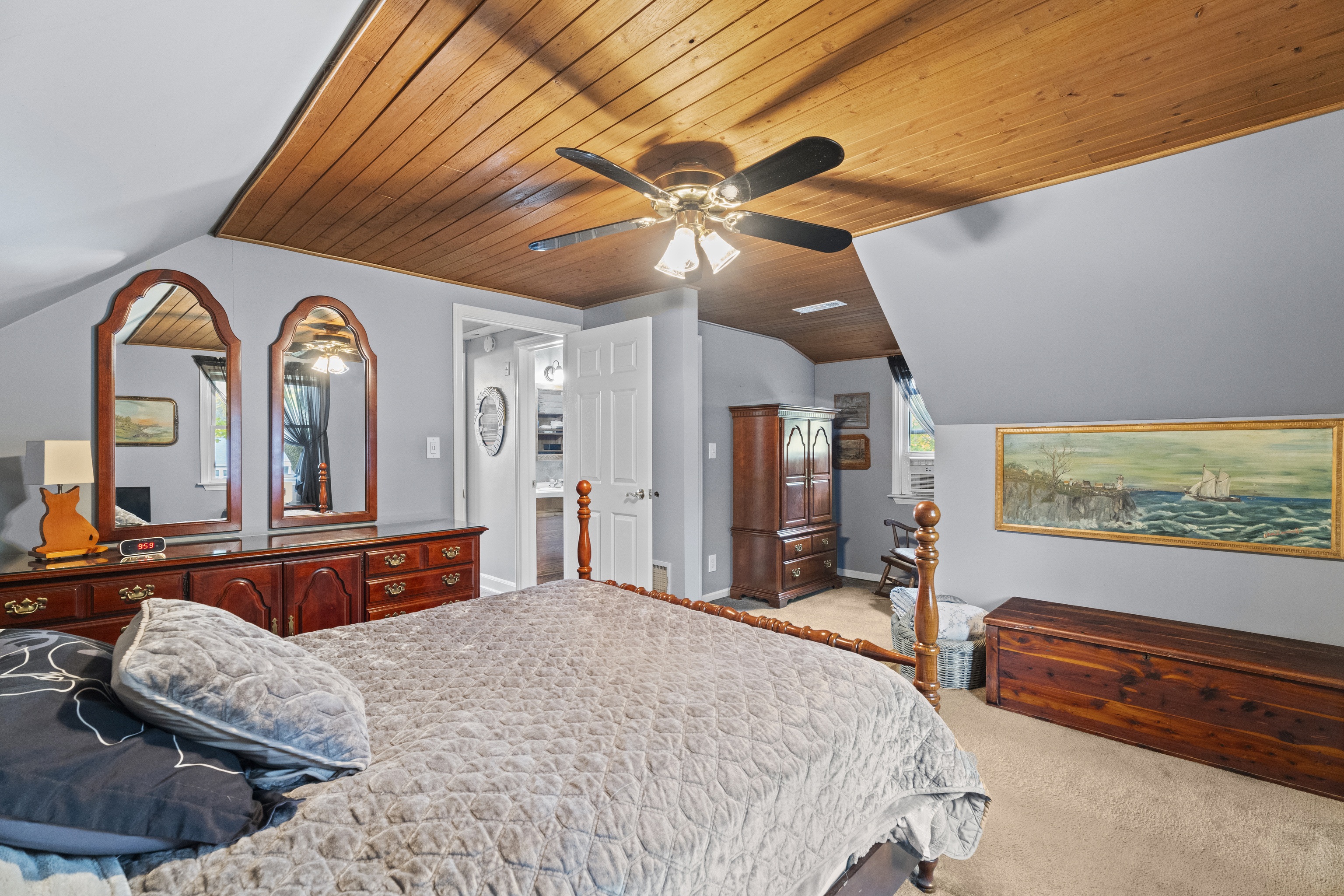 101 Pool Road North Haven, CT 06473 - Photo 15 of 23 a bedroom with a large bed and a chandelier