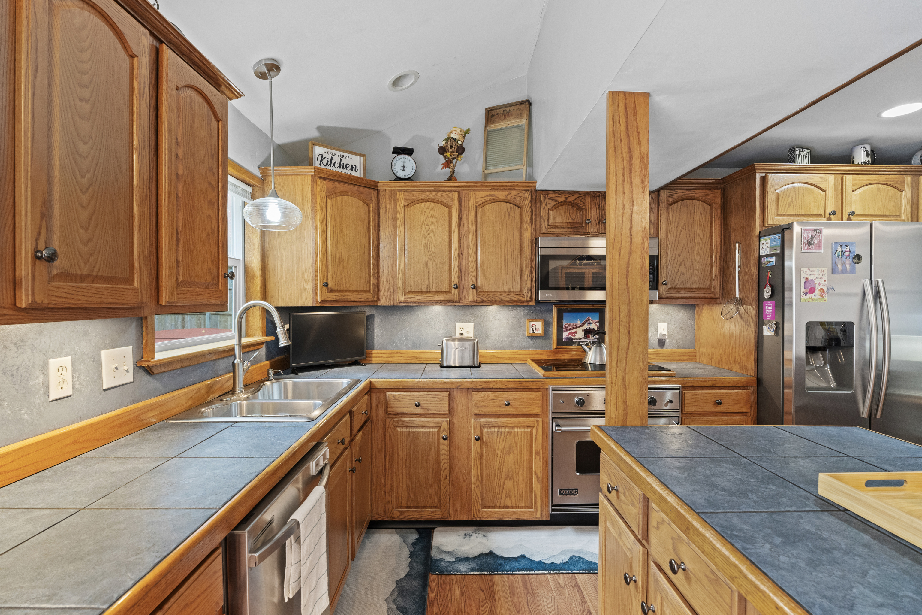 101 Pool Road North Haven, CT 06473 - Photo 4 of 23 a kitchen with stainless steel appliances granite countertop a sink a stove and a refrigerator