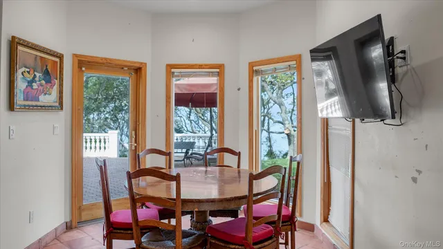 a view of a dining room with furniture window and outside view