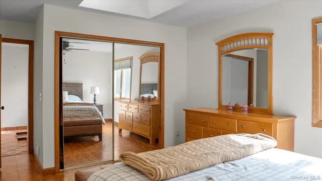 a bedroom with a bed and a walk in closet