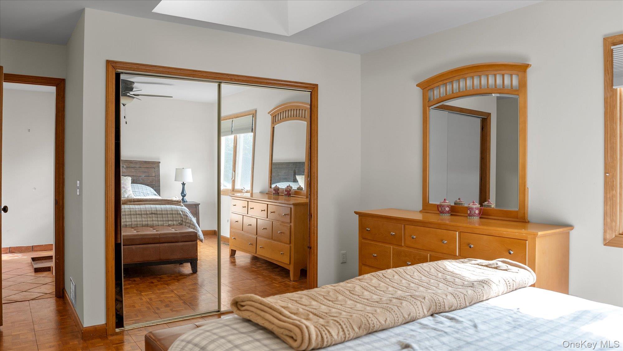3400 Dignans Road Cutchogue, NY 11935 - Photo 18 of 34 Bedroom featuring a closet and light tile patterned flooring