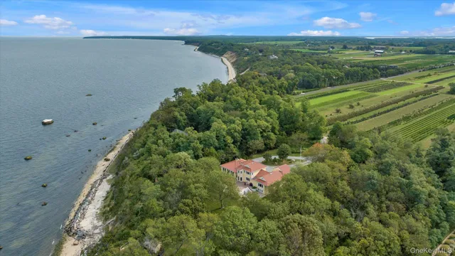 an aerial view of a houses with outdoor space and yard view