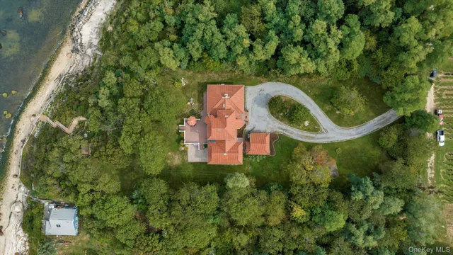 an aerial view of a house with a swimming pool