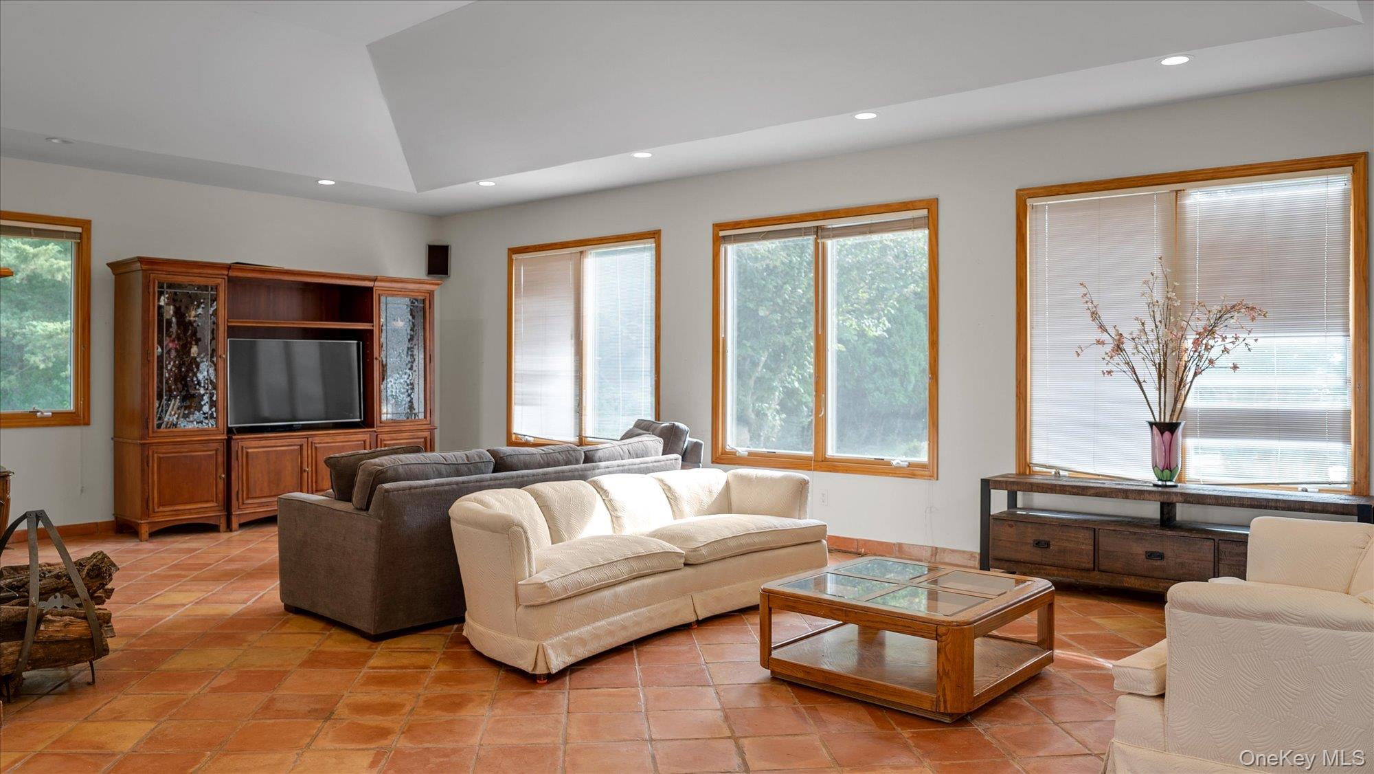 3400 Dignans Road Cutchogue, NY 11935 - Photo 7 of 34 Living room with recessed lighting and light tile patterned floors