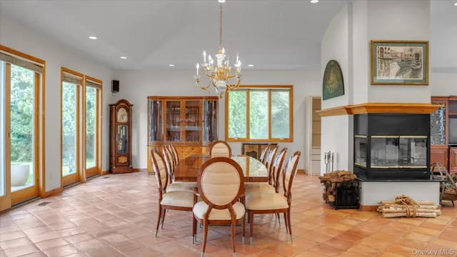 a view of a dining room with furniture window and outside view
