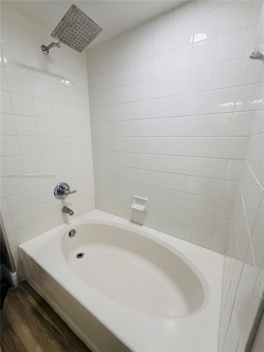 2665 Southwest 37th Avenue, Unit 408 Miami, FL 33133 - Photo 11 of 30 a bathroom with a bathtub