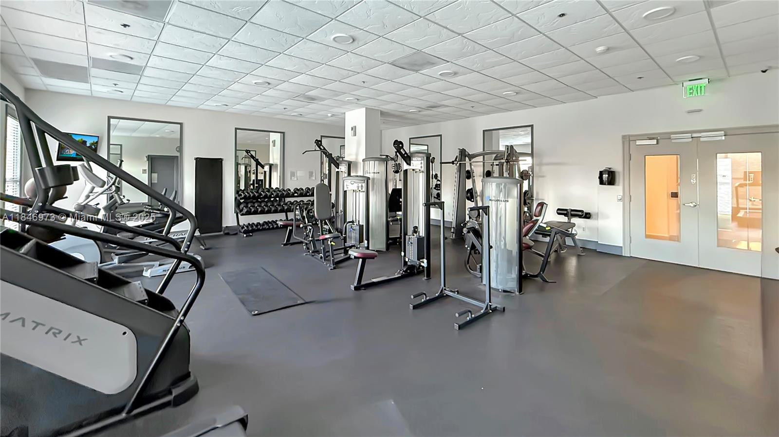2665 Southwest 37th Avenue, Unit 408 Miami, FL 33133 - Photo 18 of 30 a view of a room with gym equipment
