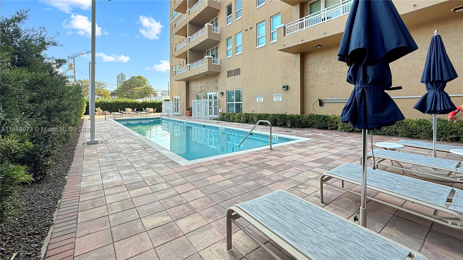 2665 Southwest 37th Avenue, Unit 408 Miami, FL 33133 - Photo 21 of 30 a view of a patio with chairs and potted plants