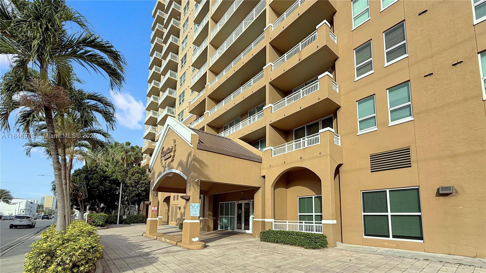 2665 Southwest 37th Avenue, Unit 408 Miami, FL 33133 - Photo 23 of 30 a view of a building with a tree