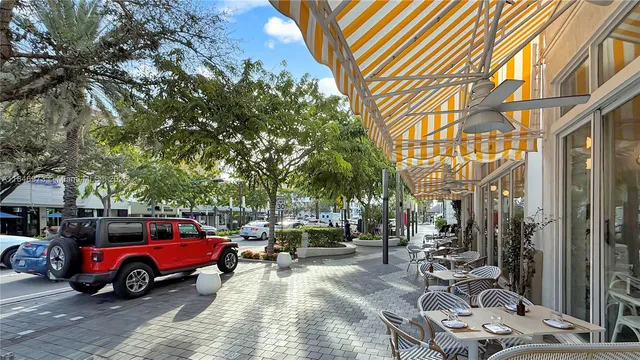 a view of a cars in front of a house