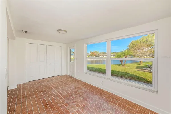 a view of a room with wooden floor and walls