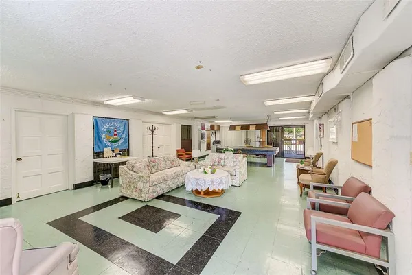 a living room with furniture and a rug