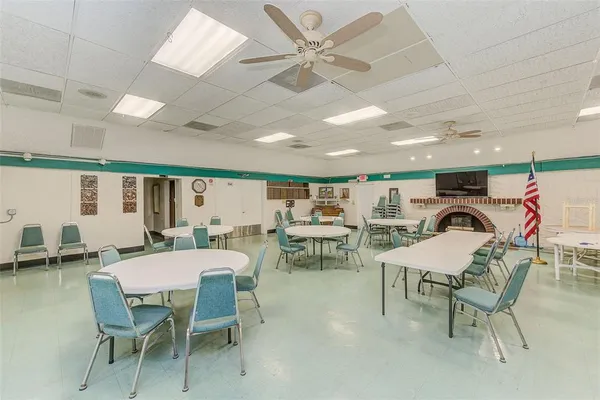 a dining room with furniture and a chandelier