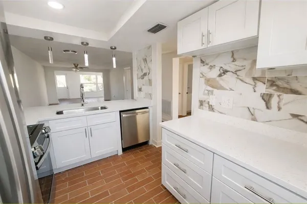 a spacious bathroom with a double vanity sink mirror and