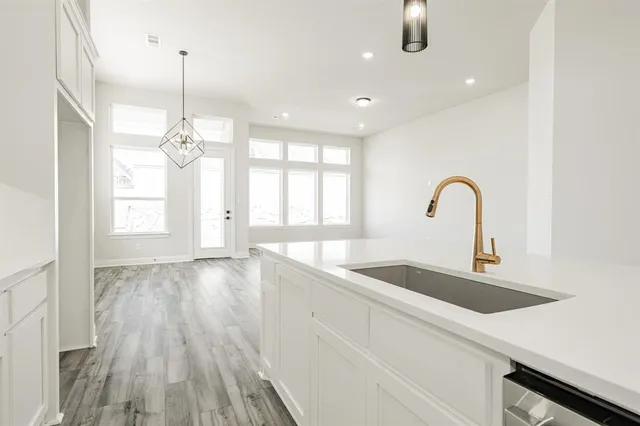 a kitchen with sink and window