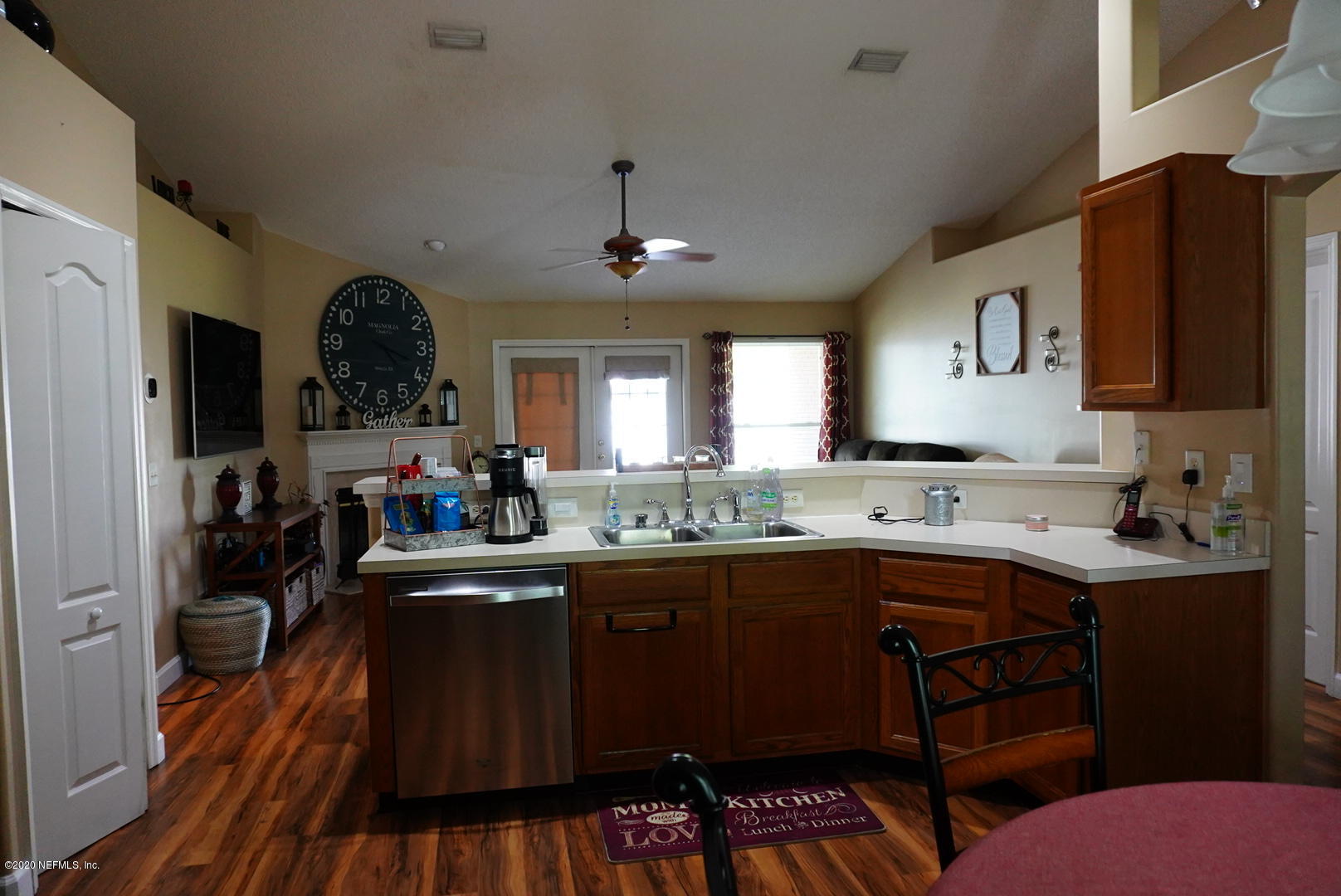 2427 Paris Mill Road Jacksonville, FL 32221 - Photo 4 of 14 a kitchen with a sink a stove cabinets and wooden floor