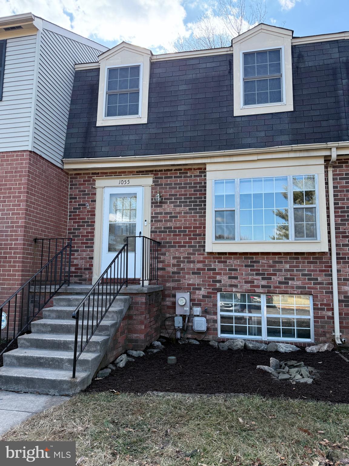 1055 Bulman Harbour Pasadena, MD 21122 - Photo 2 of 36 a view of a brick house with a yard