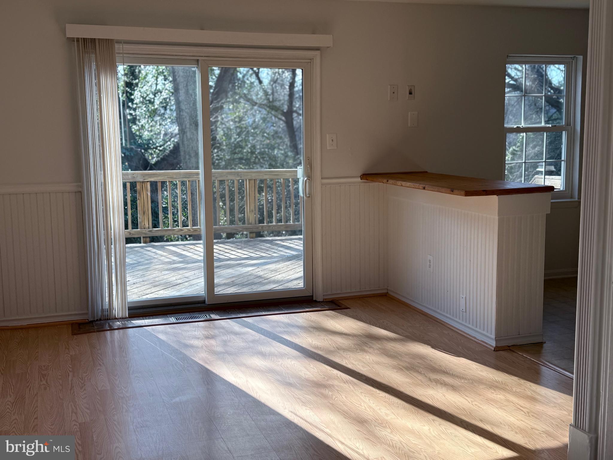 1055 Bulman Harbour Pasadena, MD 21122 - Photo 10 of 36 an empty room with wooden floor and windows