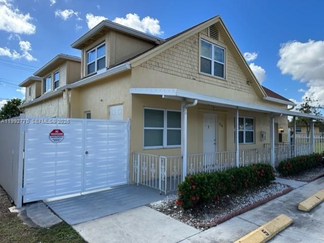 274 East 9th Street, Unit 4 Hialeah, FL 33010 - Photo 20 of 21 a front view of a house with garden