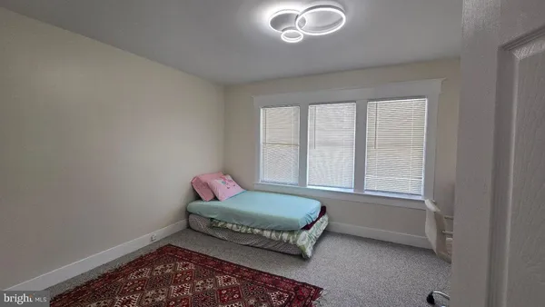a view of an empty room and a window
