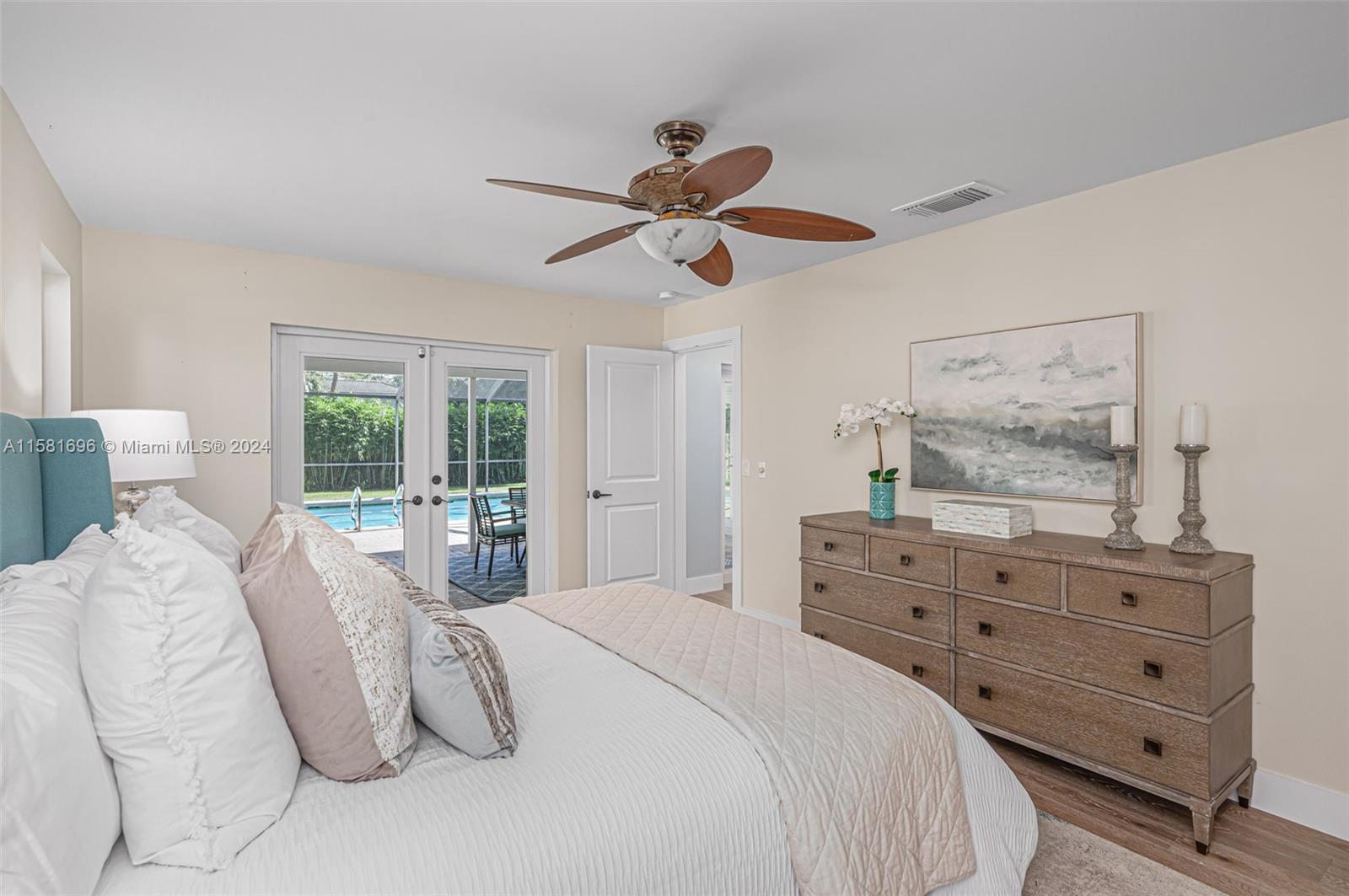 138 Buttonwood Way Tequesta, FL 33469 - Photo 16 of 27 a bedroom with a bed and window