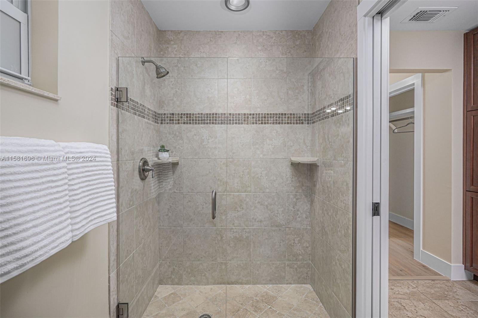 138 Buttonwood Way Tequesta, FL 33469 - Photo 18 of 27 a bathroom with a shower