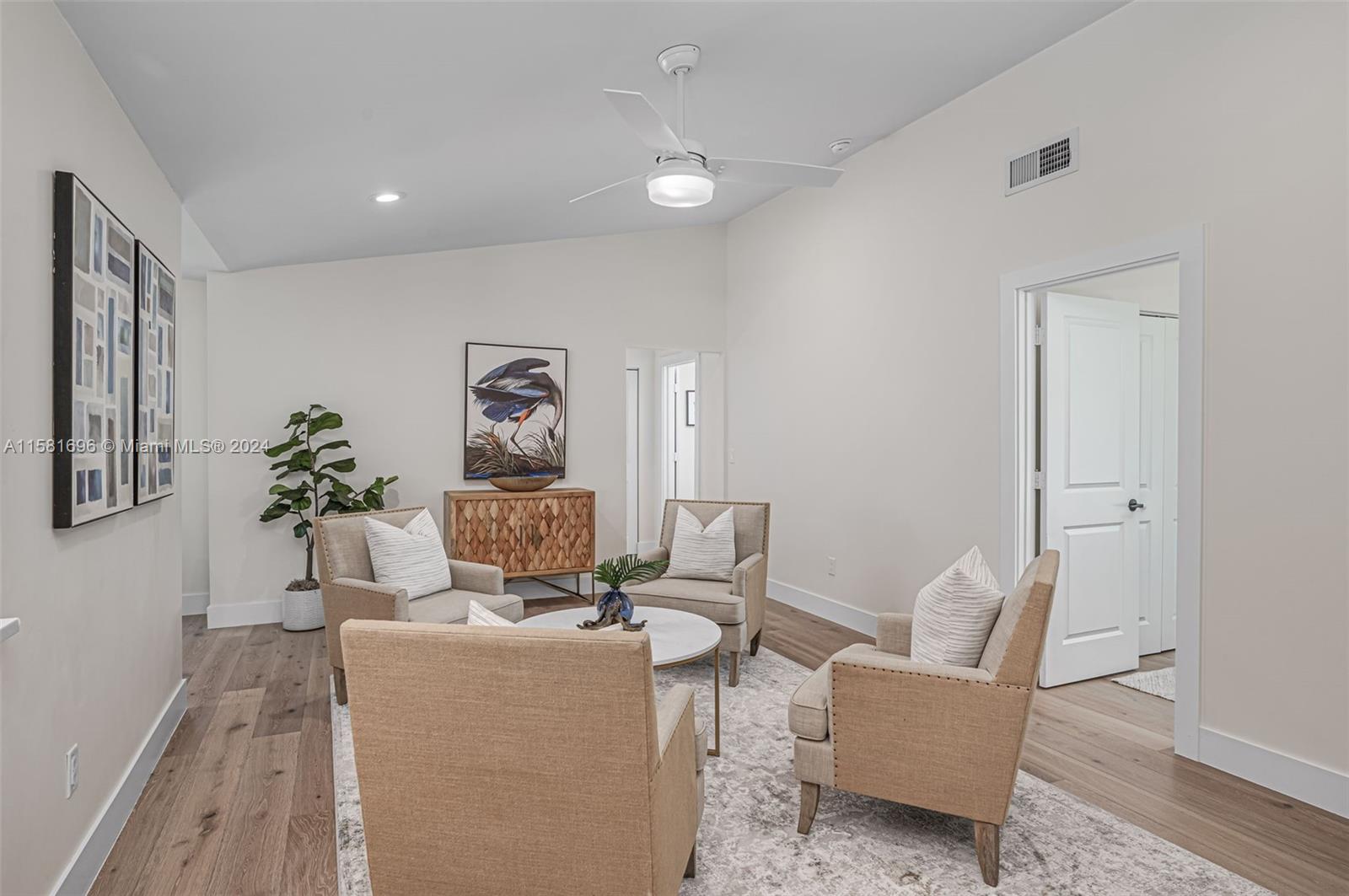 138 Buttonwood Way Tequesta, FL 33469 - Photo 4 of 27 a living room with furniture and painting on the wall