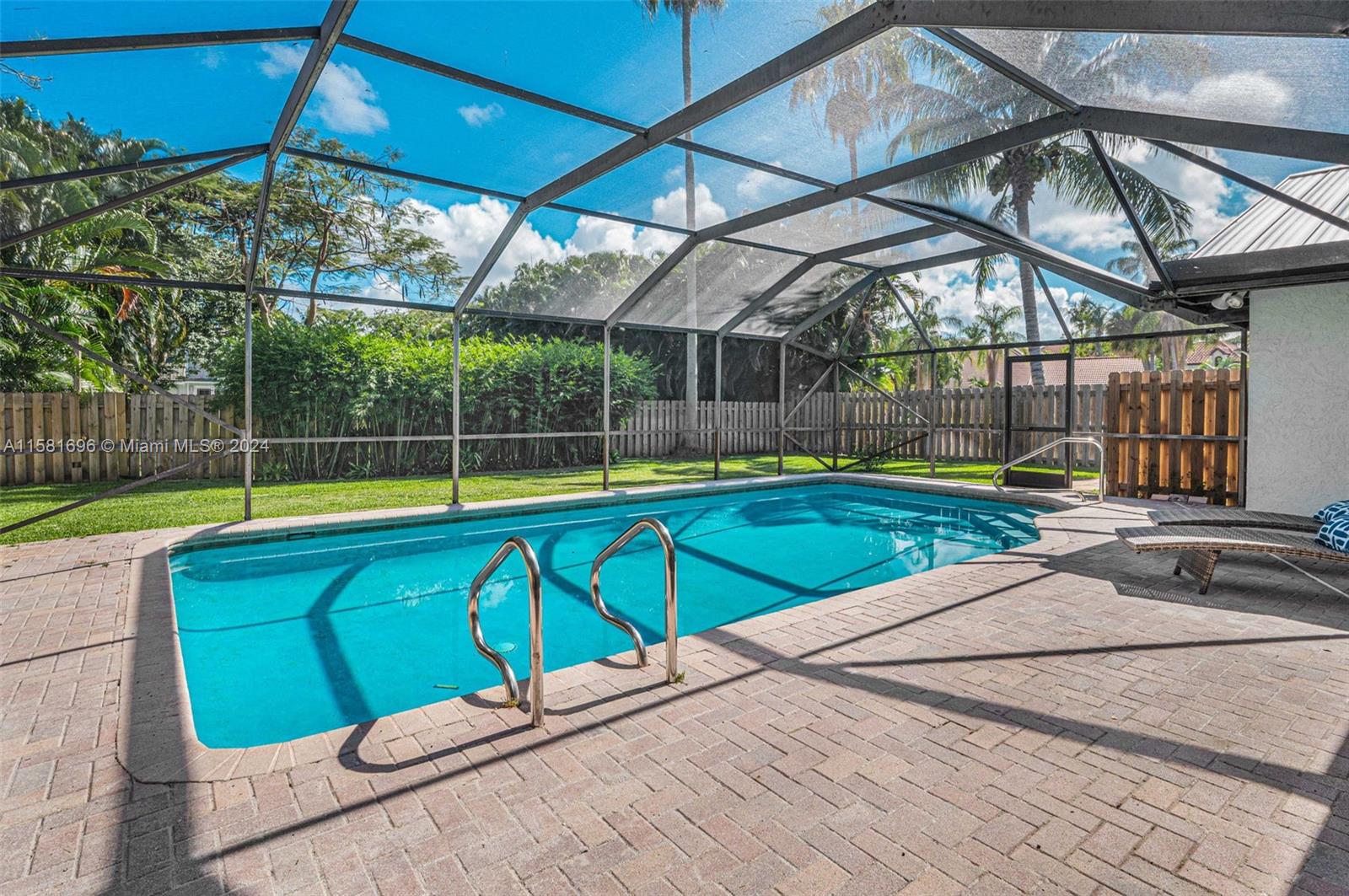 138 Buttonwood Way Tequesta, FL 33469 - Photo 5 of 27 a swimming pool with an outdoor seating yard and patio