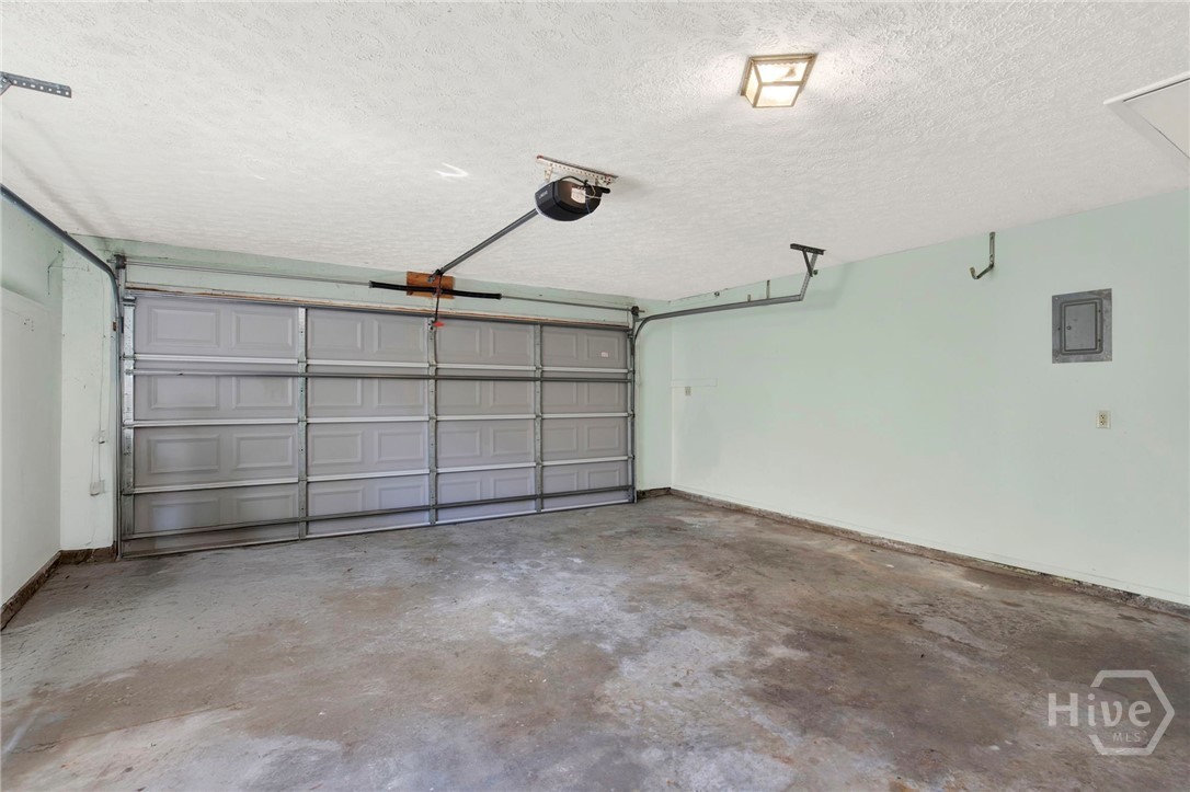 910 Old Mill Road Savannah, GA 31419 - Photo 34 of 41 Double garage with electric door opener, extra work space and access to the kitchen.
