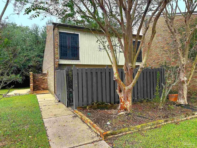 a backyard of a house with seating space