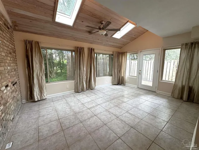 a view of entryway with stairs and a front door