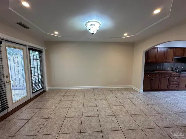 a view of an empty room with a stove