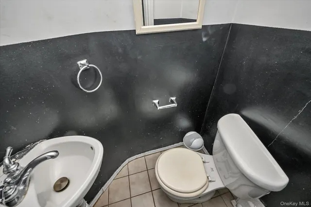 a bathroom with a toilet and a sink