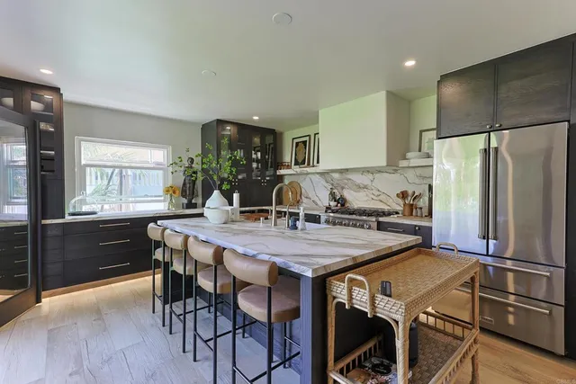 a kitchen with a stove and a sink