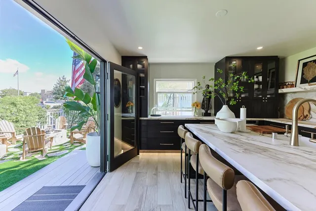 a room with wooden floor and large window