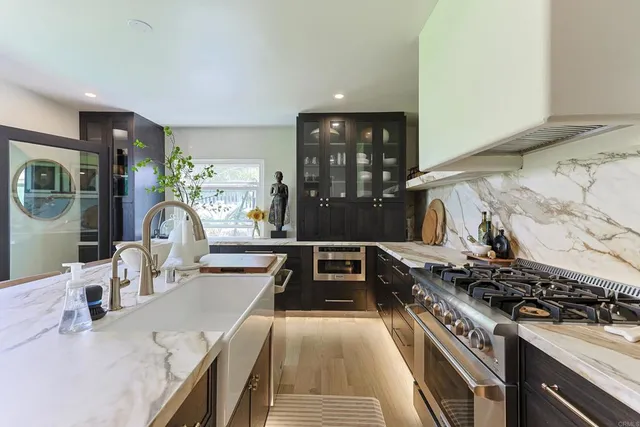 a living room with furniture and potted plant